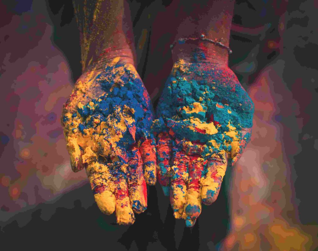 hands with Holi color 